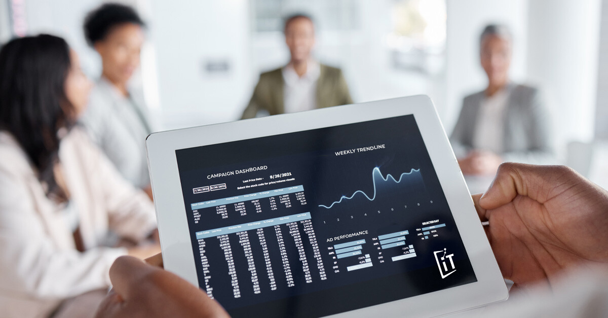 marketing team reviewing campaign data on a tablet computer - iTalent Digital blog