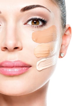 woman's face with three different shades of foundation spread on her cheek - iTalent Digital blog