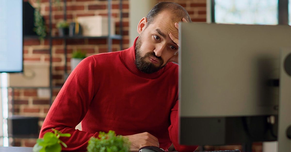 man looking at a computer monitor - iTalent Digital blog