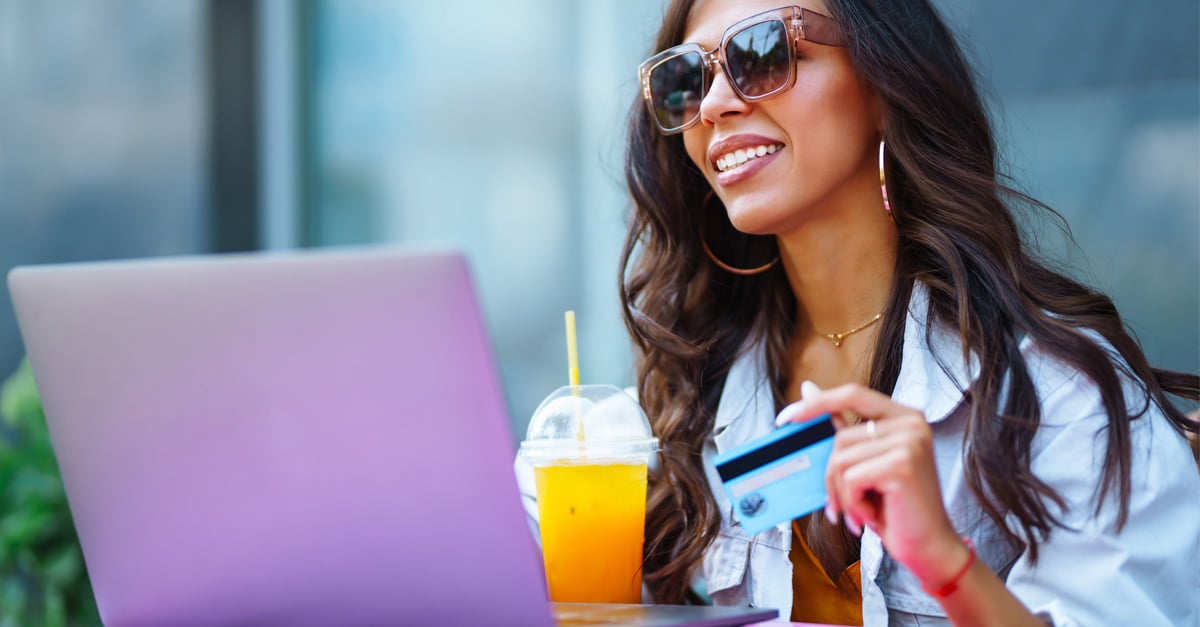 woman shopping online with a credit card in her hand - iTalent Digital blog